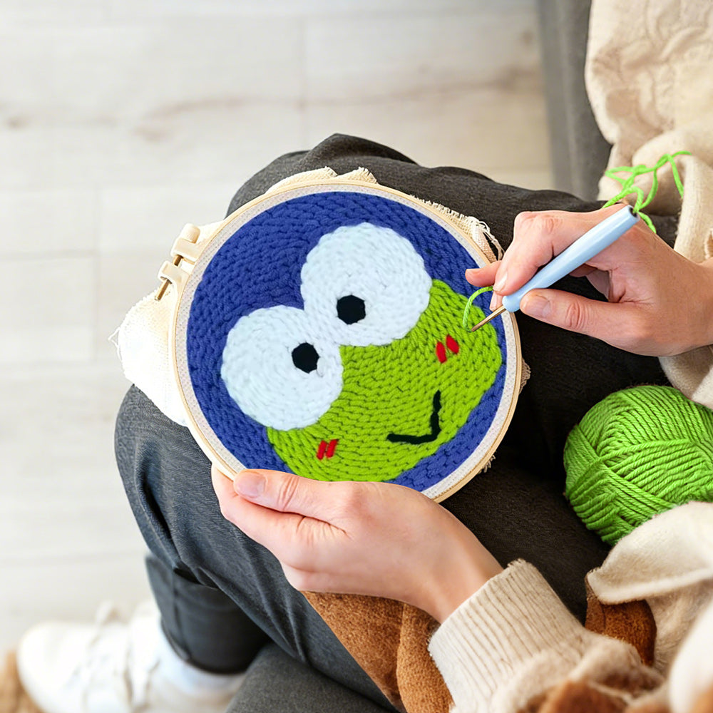 Creating handmade green frog with big eyes punch needle artwork