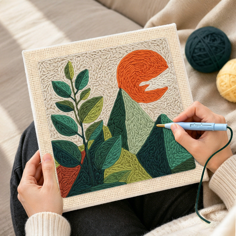 Creating handmade green leaves and mountains punch needle artwork
