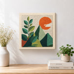 Finished green leaves and mountains artwork displayed on a wall