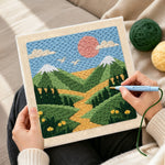 Creating handmade green mountains and yellow wildflowers punch needle artwork