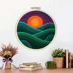 Finished green rolling hills at sunset artwork displayed on a wall
