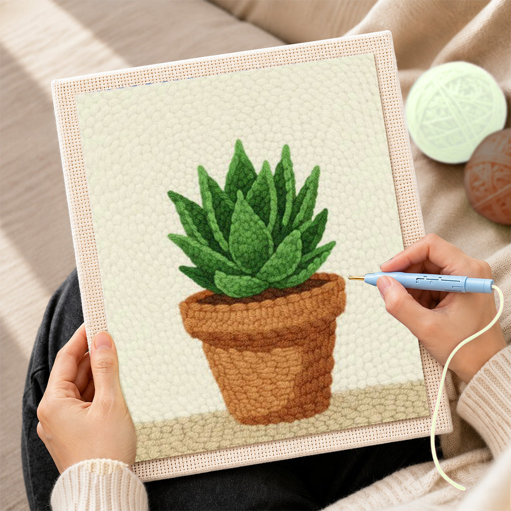 Creating handmade green succulent in terracotta pot punch needle artwork