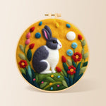 Grey and white rabbit among flowers needle felting kit for beginners with a round wooden frame