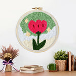 Finished growing red flower artwork displayed on a wall