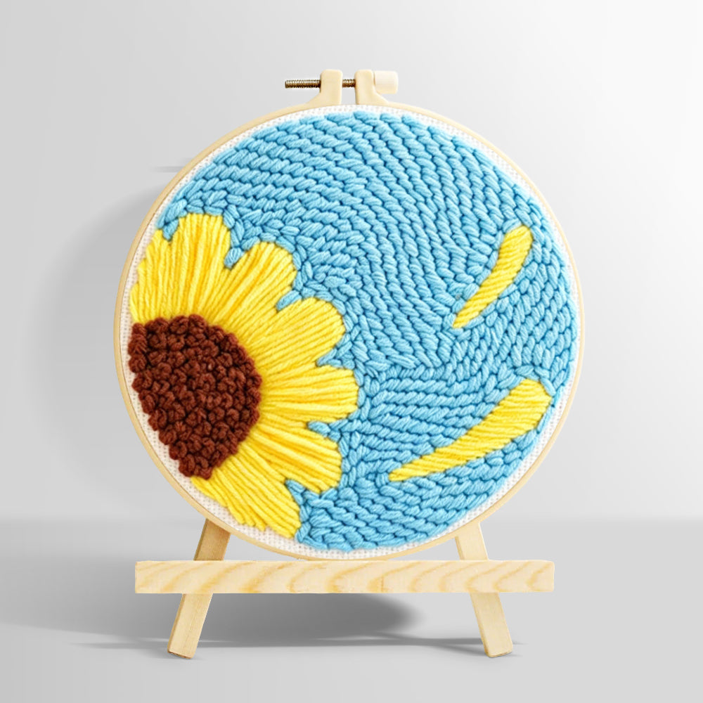 Half sunflower on blue background punch needle kit for beginners