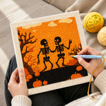 Creating handmade halloween dancing skeletons punch needle artwork