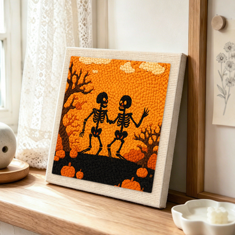 Halloween dancing skeletons punch needle artwork displayed on a table