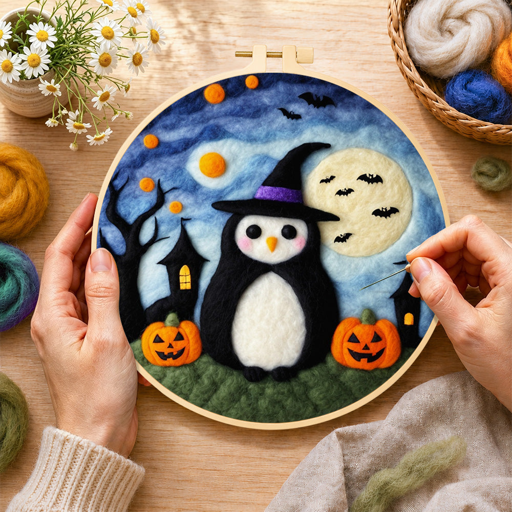 Creating the halloween penguin in witch hat wool painting by hand with a felting needle
