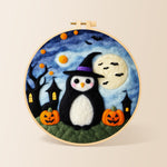 Halloween penguin in witch hat needle felting kit for beginners with a round wooden frame