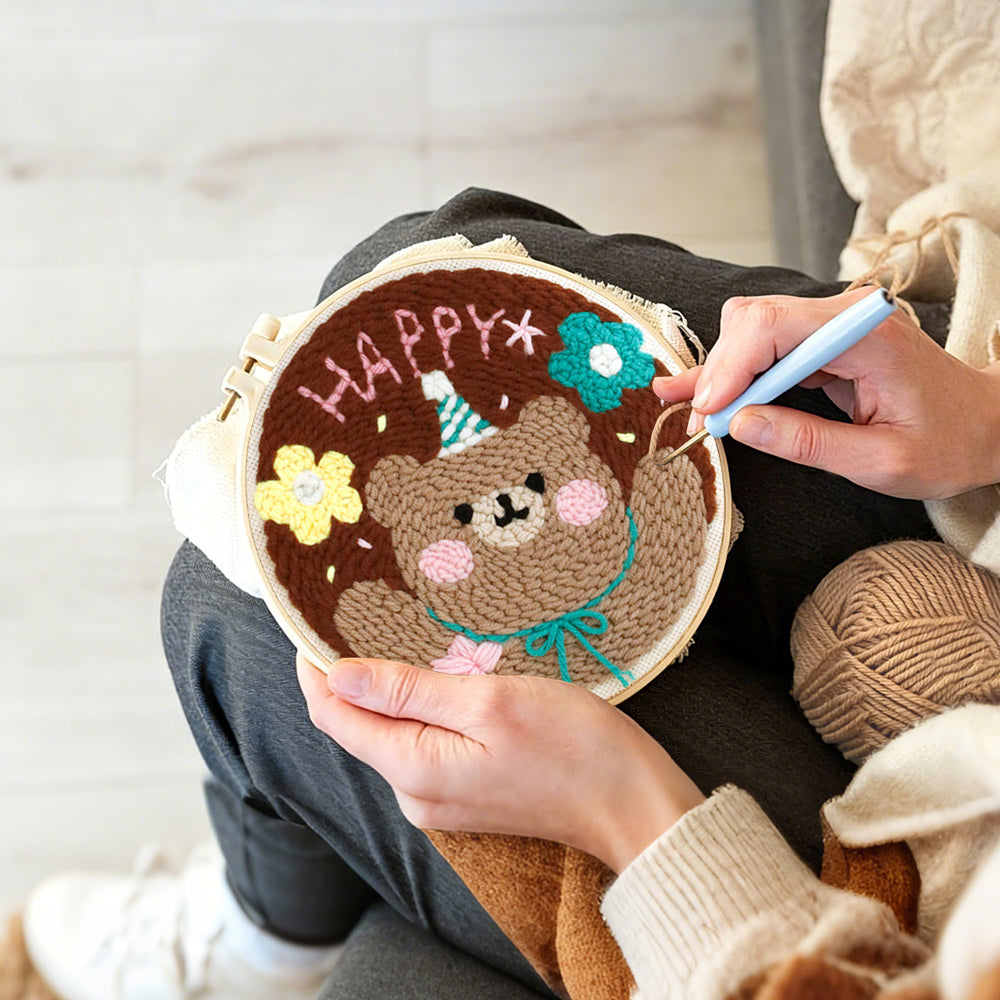 Creating handmade happy bear with flowers punch needle artwork