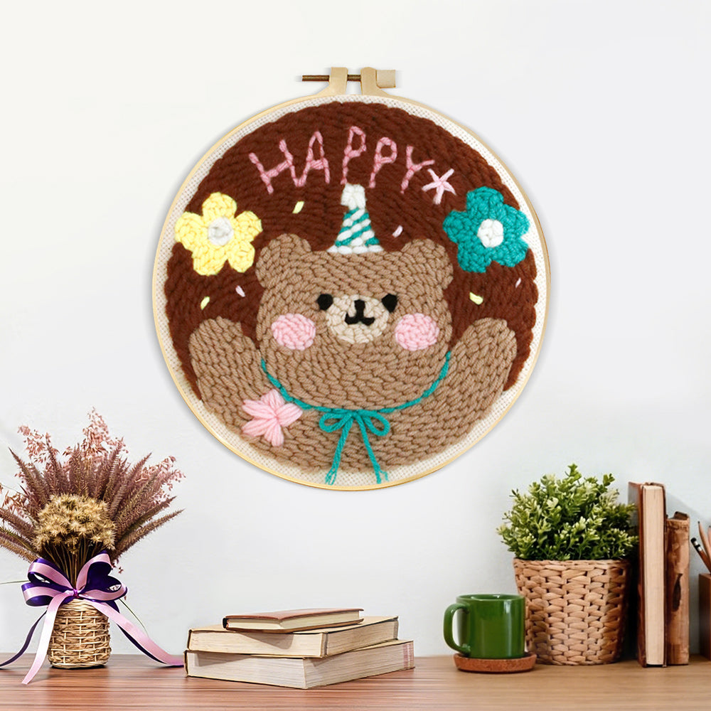 Finished happy bear with flowers artwork displayed on a wall