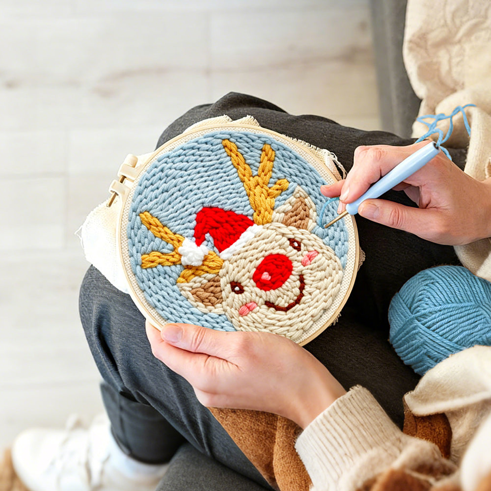 Creating handmade happy christmas reindeer punch needle artwork
