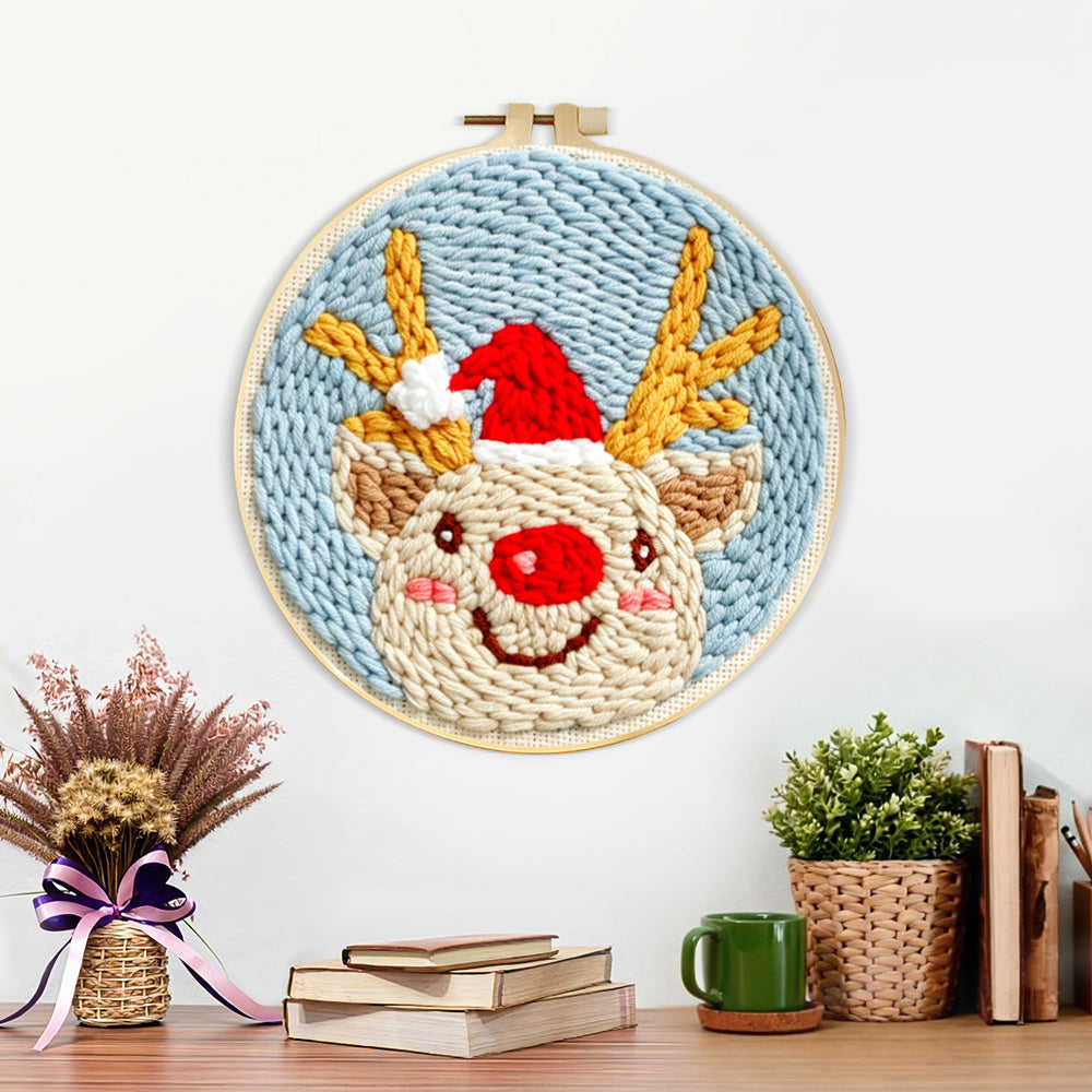 Finished happy christmas reindeer artwork displayed on a wall