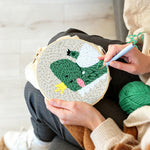 Creating handmade happy crown dinosaur punch needle artwork