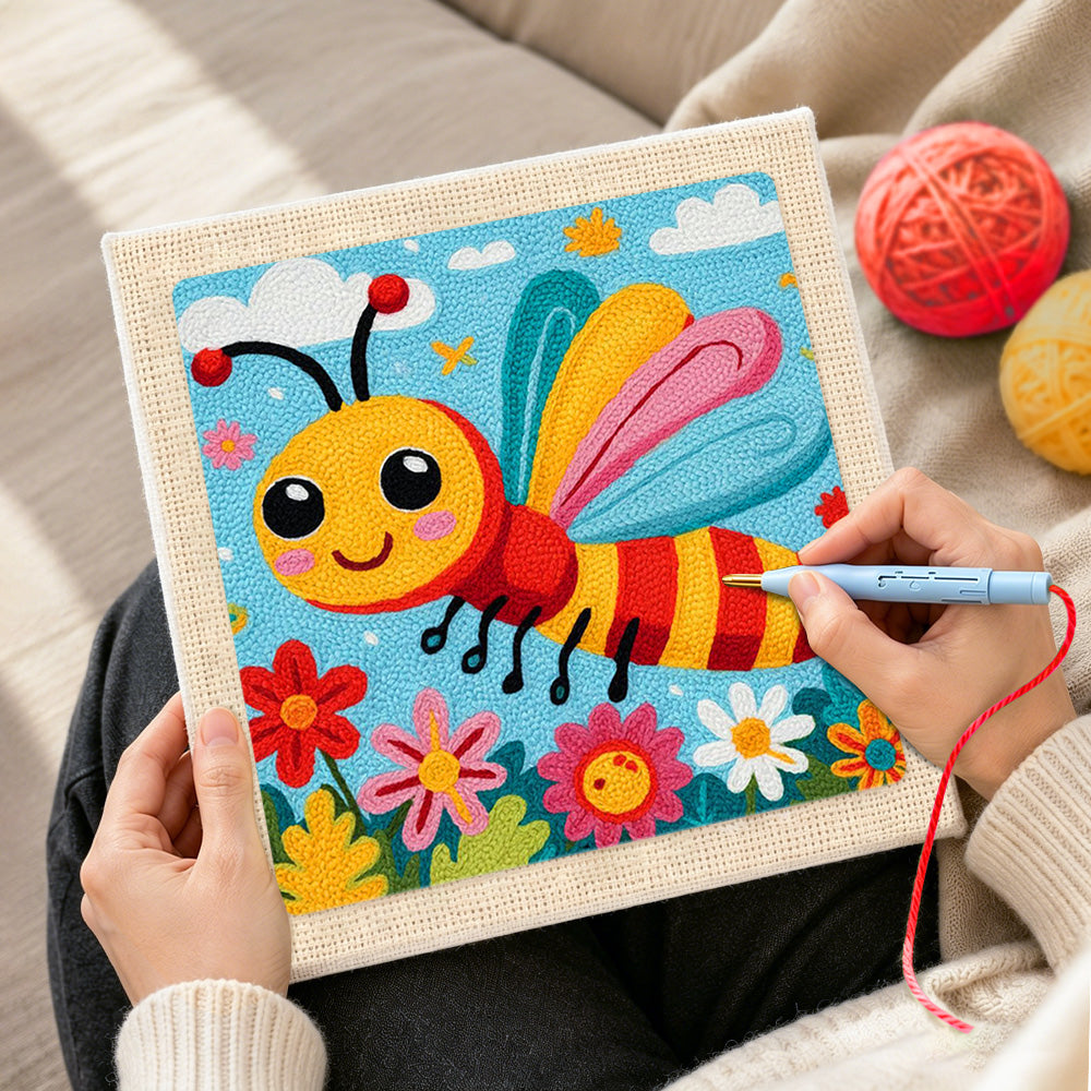 Creating handmade happy flying bee in a flower garden punch needle artwork