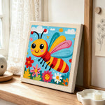Happy flying bee in a flower garden punch needle artwork displayed on a table