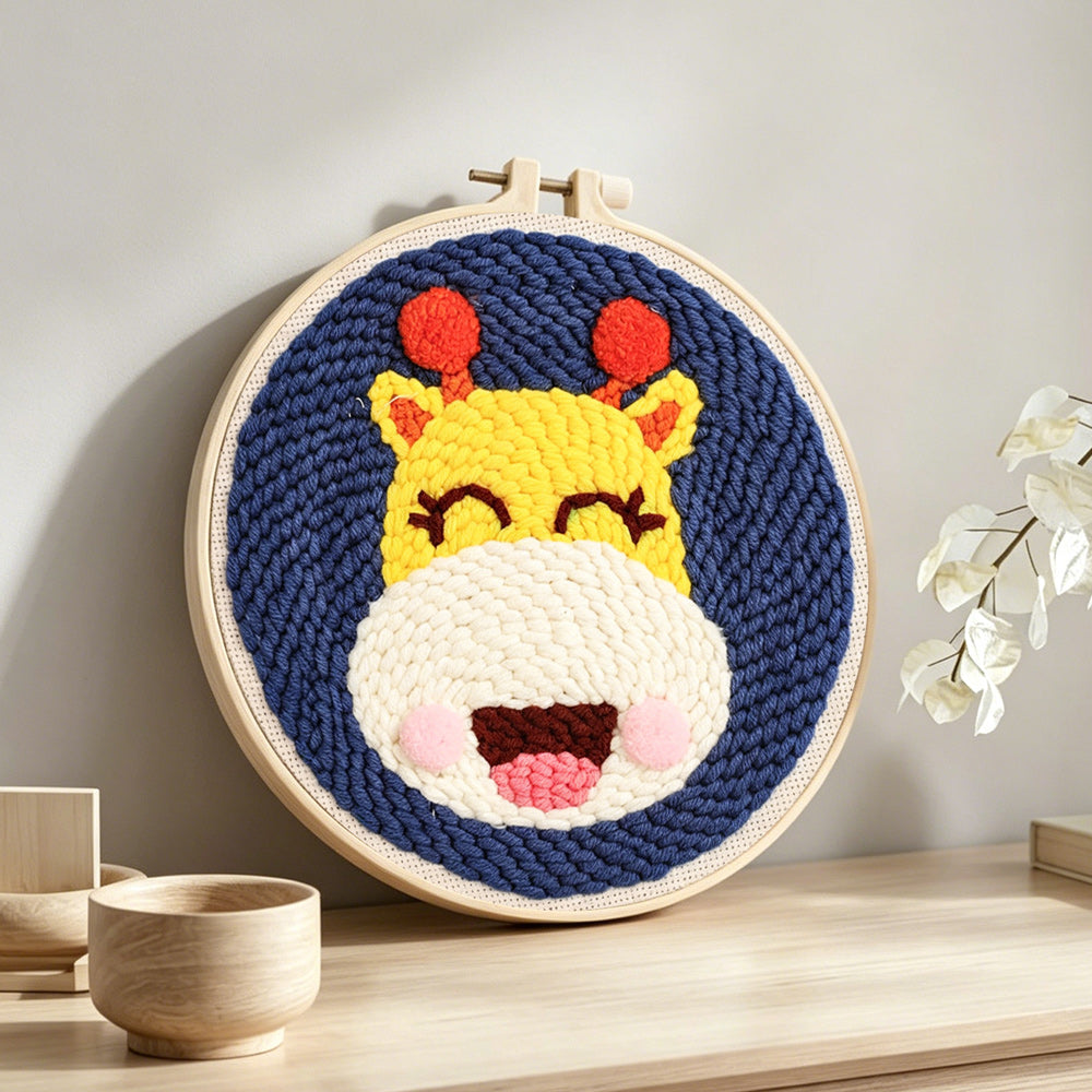 Happy giraffe punch needle artwork displayed on a table