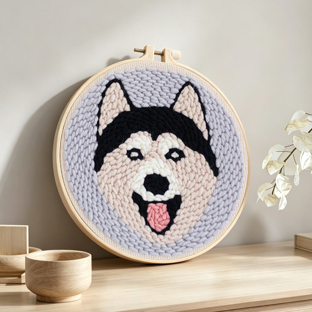 Happy husky punch needle artwork displayed on a table
