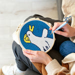 Creating handmade happy little duck punch needle artwork