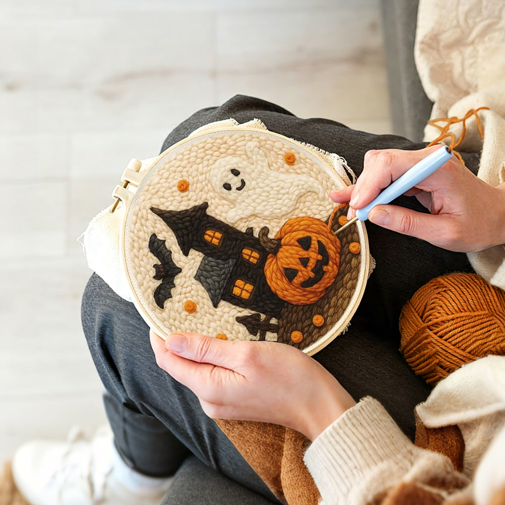 Creating handmade haunted house, ghost and pumpkin punch needle artwork