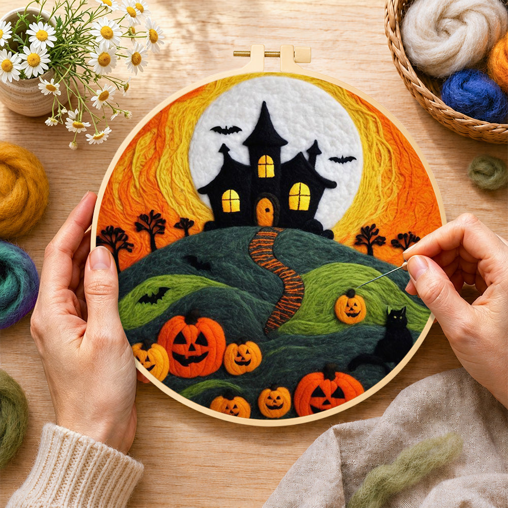 Creating the Haunted house on hill with pumpkins wool painting by hand with a felting needle