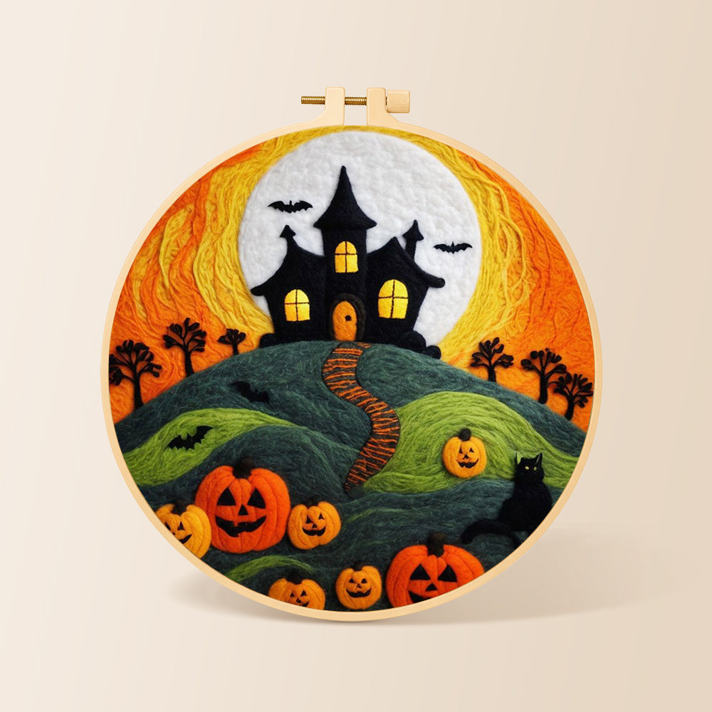 Haunted house on hill with pumpkins needle felting kit for beginners with a round wooden frame