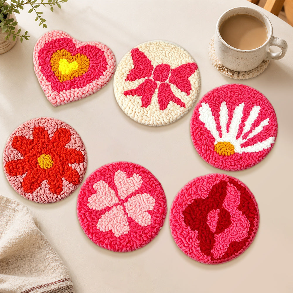Heart, flower, and four-leaf clover punch needle coasters used for home decoration