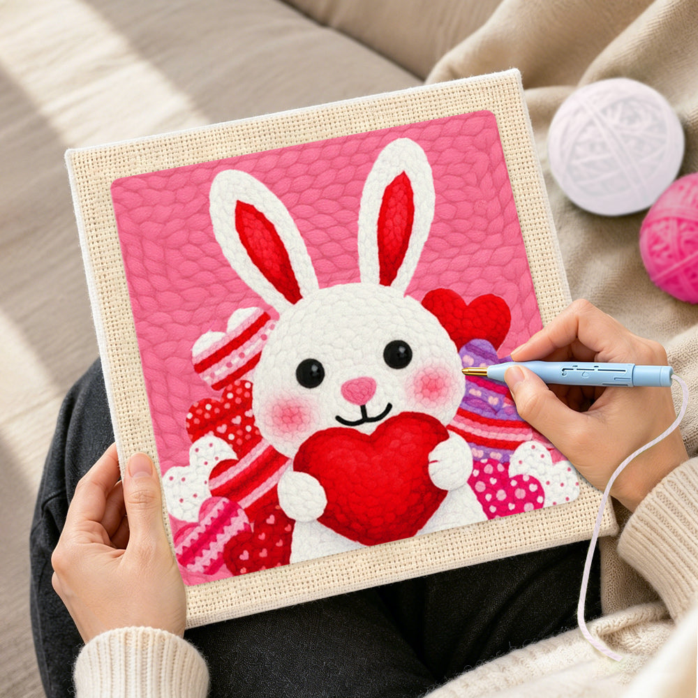Creating handmade heart-holding bunny punch needle artwork