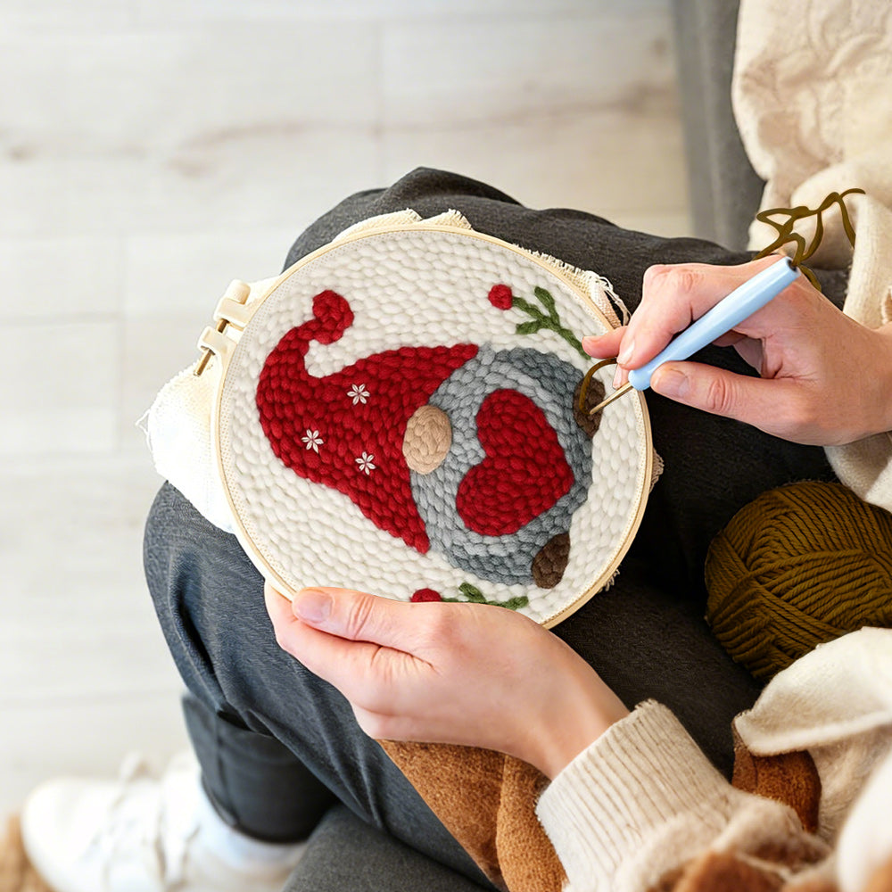 Creating handmade heart-holding winter gnome punch needle artwork