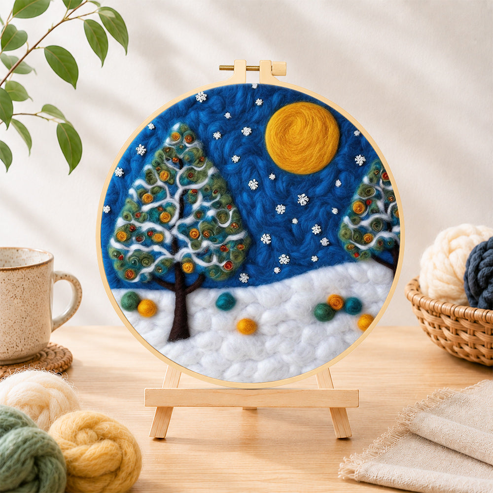 Finished heart-shaped christmas tree in the snow needle felting displayed on a wooden easel