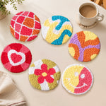 Heart, swirl and smiley punch needle coasters used for home decoration