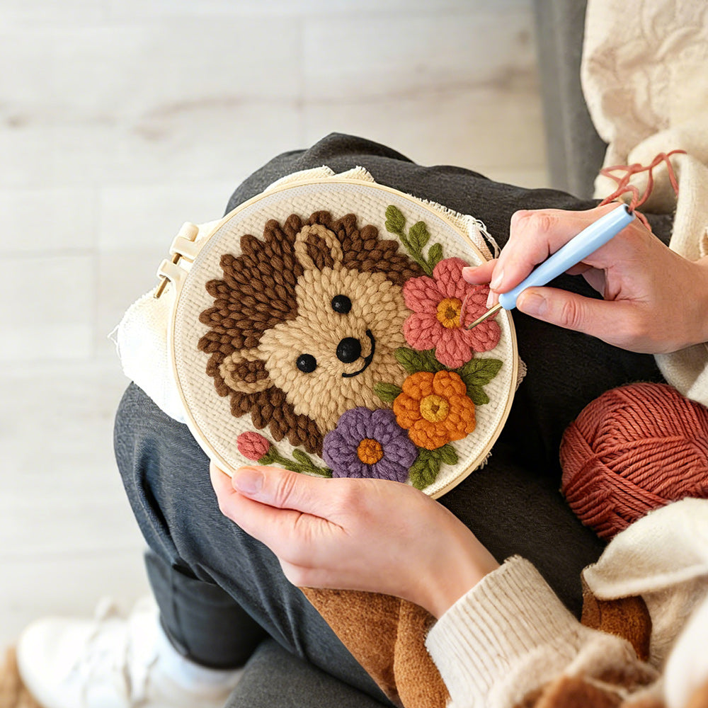 Creating handmade hedgehog with flowers punch needle artwork