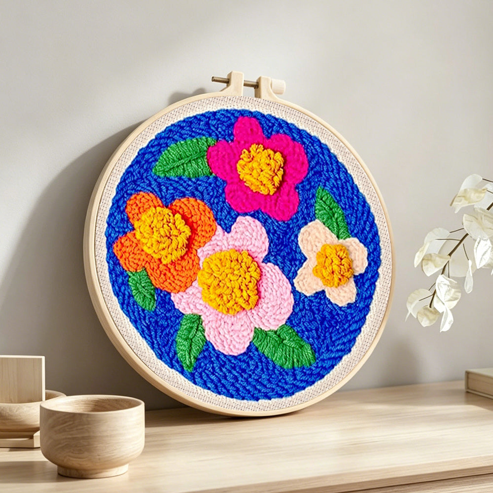 High contrast flowers punch needle artwork displayed on a table