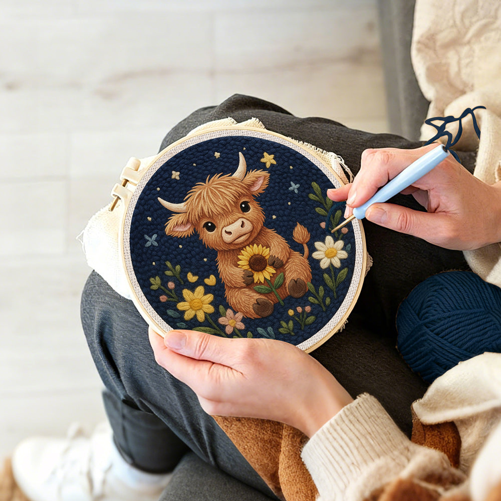 Creating handmade highland cow and flowers at night punch needle artwork