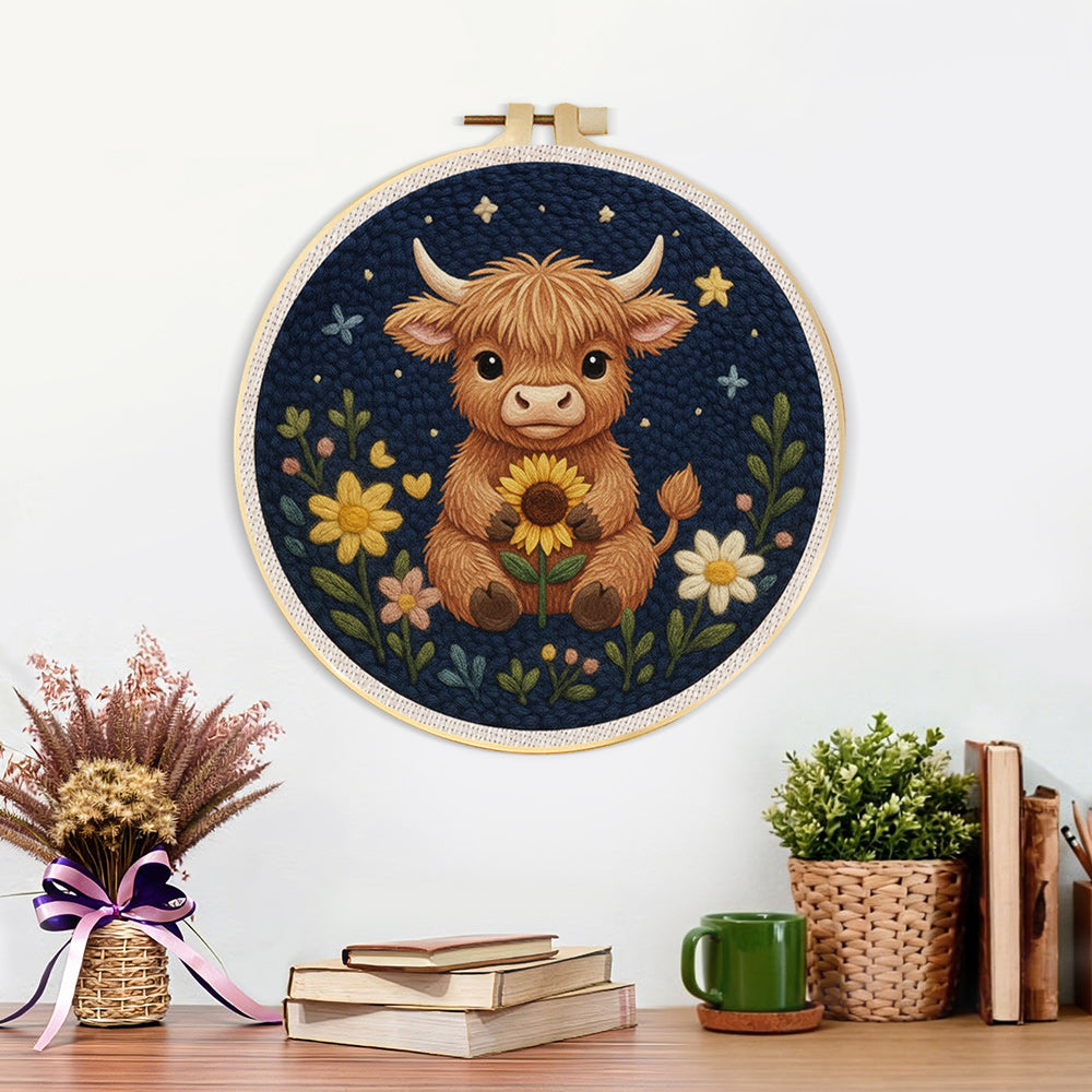 Finished highland cow and flowers at night artwork displayed on a wall