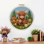 Finished highland cow and mushrooms in spring artwork displayed on a wall