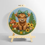 Highland cow and mushrooms on the green grass punch needle kit for beginners