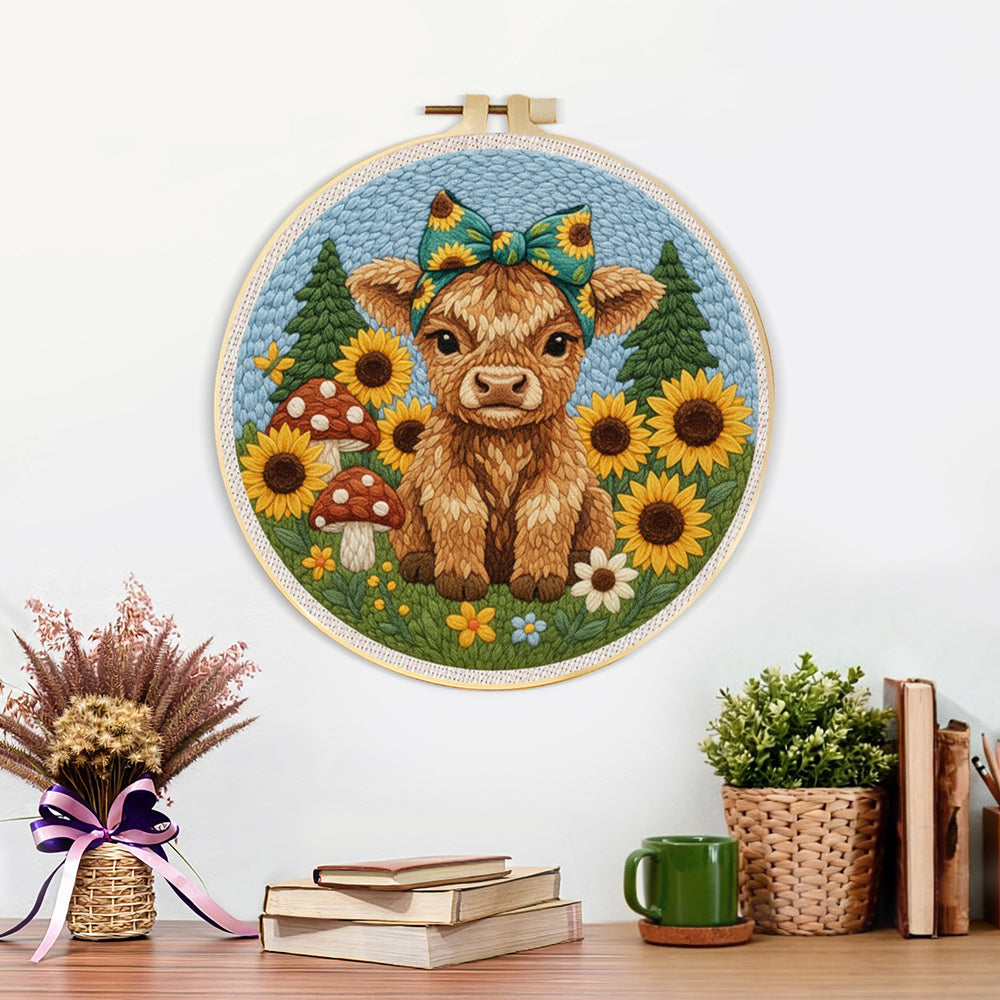 Finished highland cow and sunflowers on the green grass artwork displayed on a wall