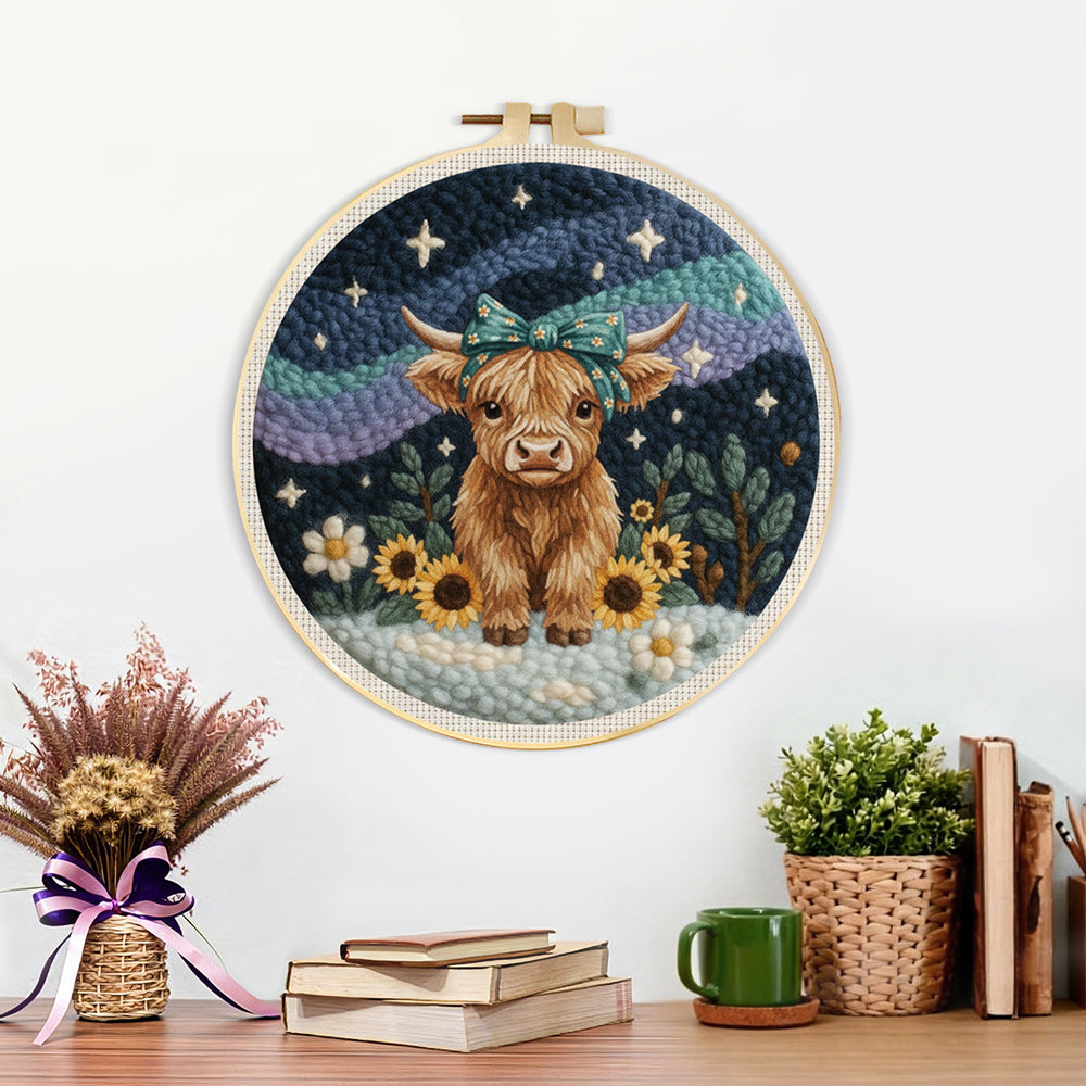Finished highland cow, mountains and sunflowers artwork displayed on a wall