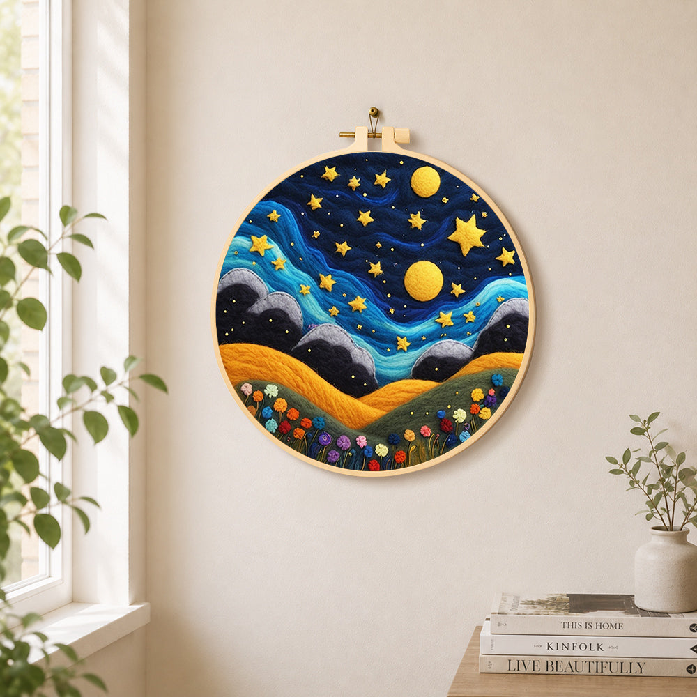 Hills under the whimsical night sky needle felt wall art displayed in a bright home interior