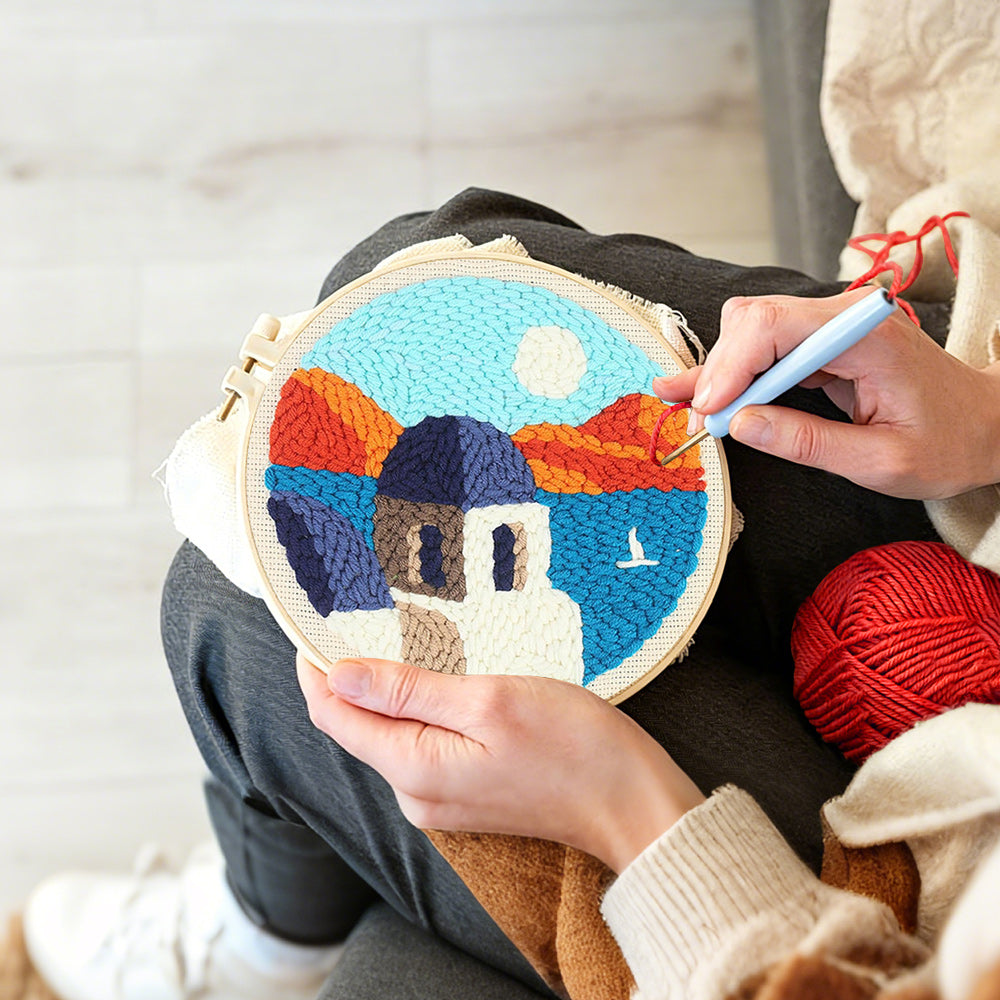 Creating handmade house by the sea and mountains punch needle artwork