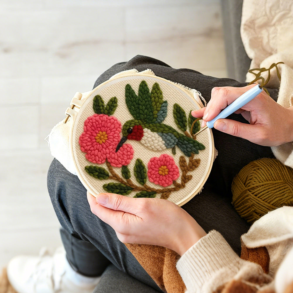Creating handmade hummingbird and pink flowers punch needle artwork