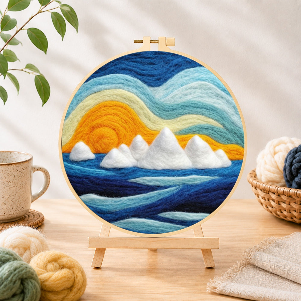 Finished icebergs at sunset needle felting displayed on a wooden easel