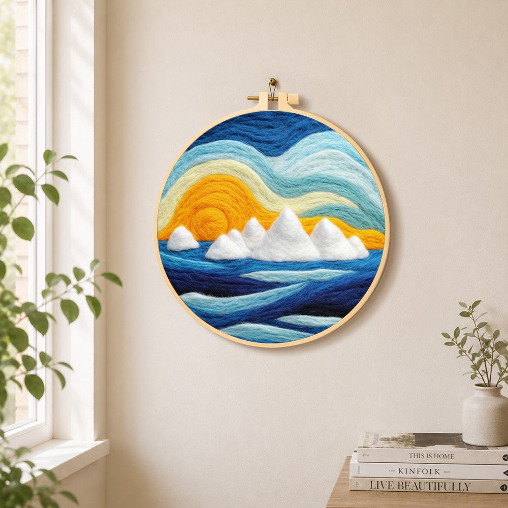 Icebergs at sunset needle felt wall art displayed in a bright home interior