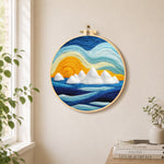 Icebergs at sunset needle felt wall art displayed in a bright home interior