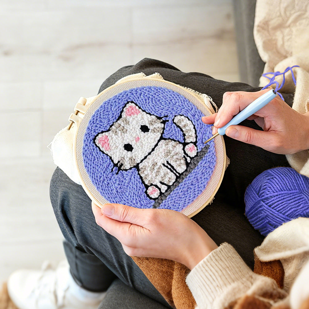 Creating handmade innocent little kitten punch needle artwork