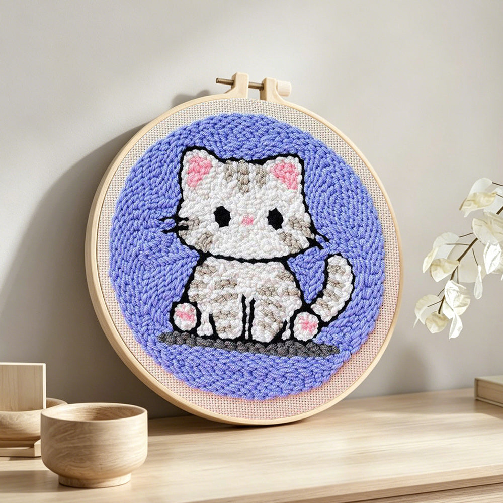 Innocent little kitten punch needle artwork displayed on a table