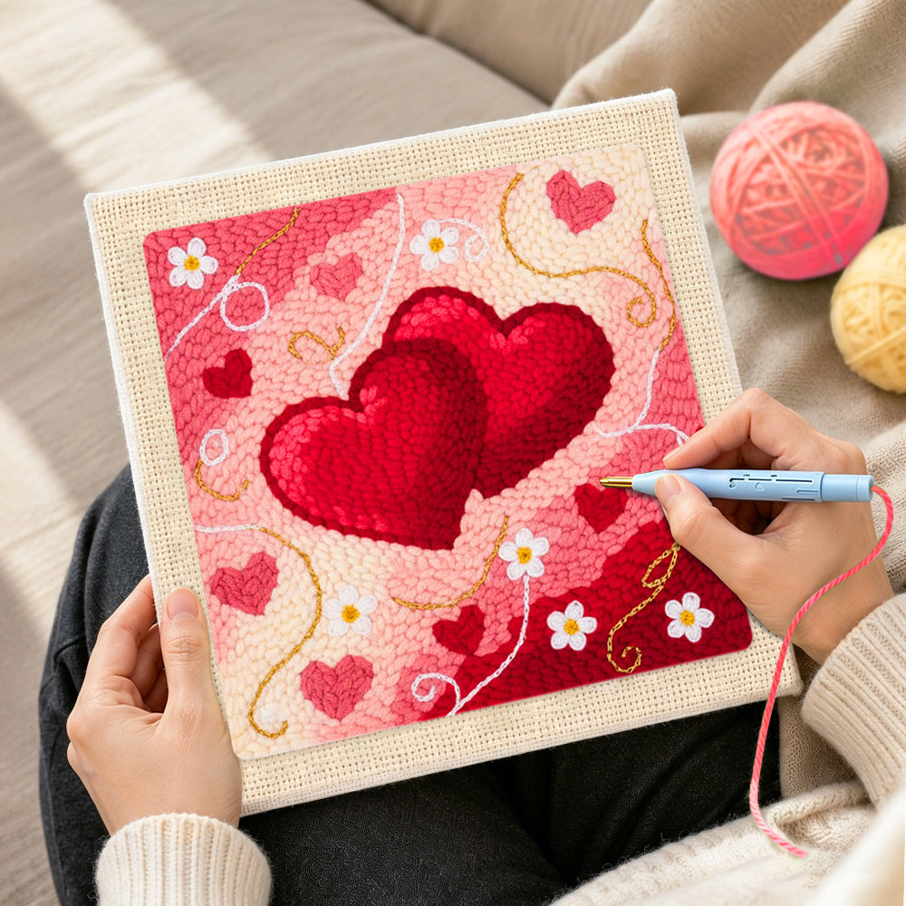 Creating handmade intertwined hearts punch needle artwork