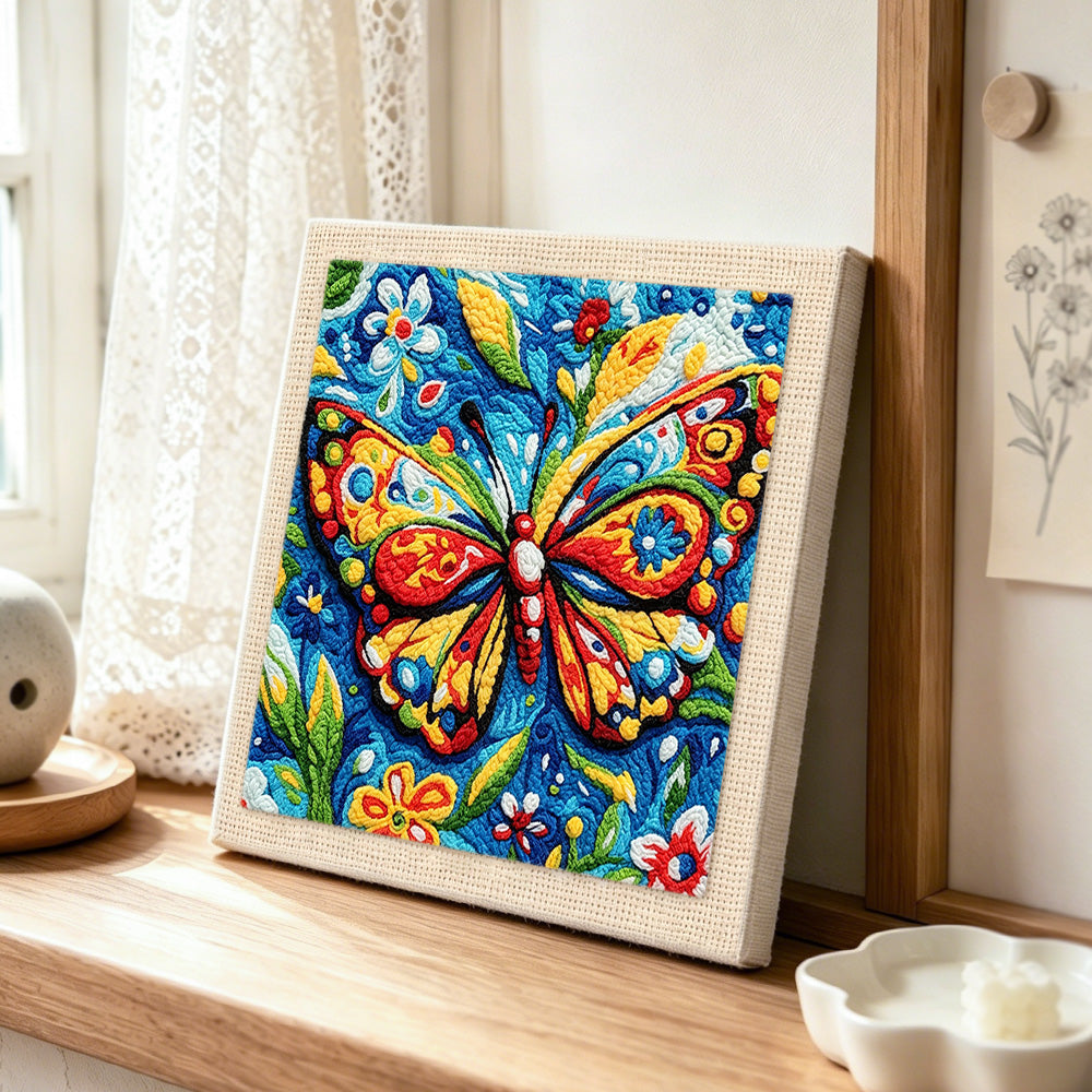 Intricate floral butterfly punch needle artwork displayed on a table