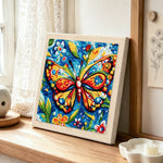 Intricate floral butterfly punch needle artwork displayed on a table
